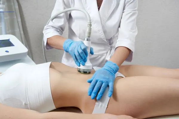 Lost the Weight but Not the Loose Skin? 2 woman having HIFU treatment on her stomach to combat loose skin Market Drayton following weight loss